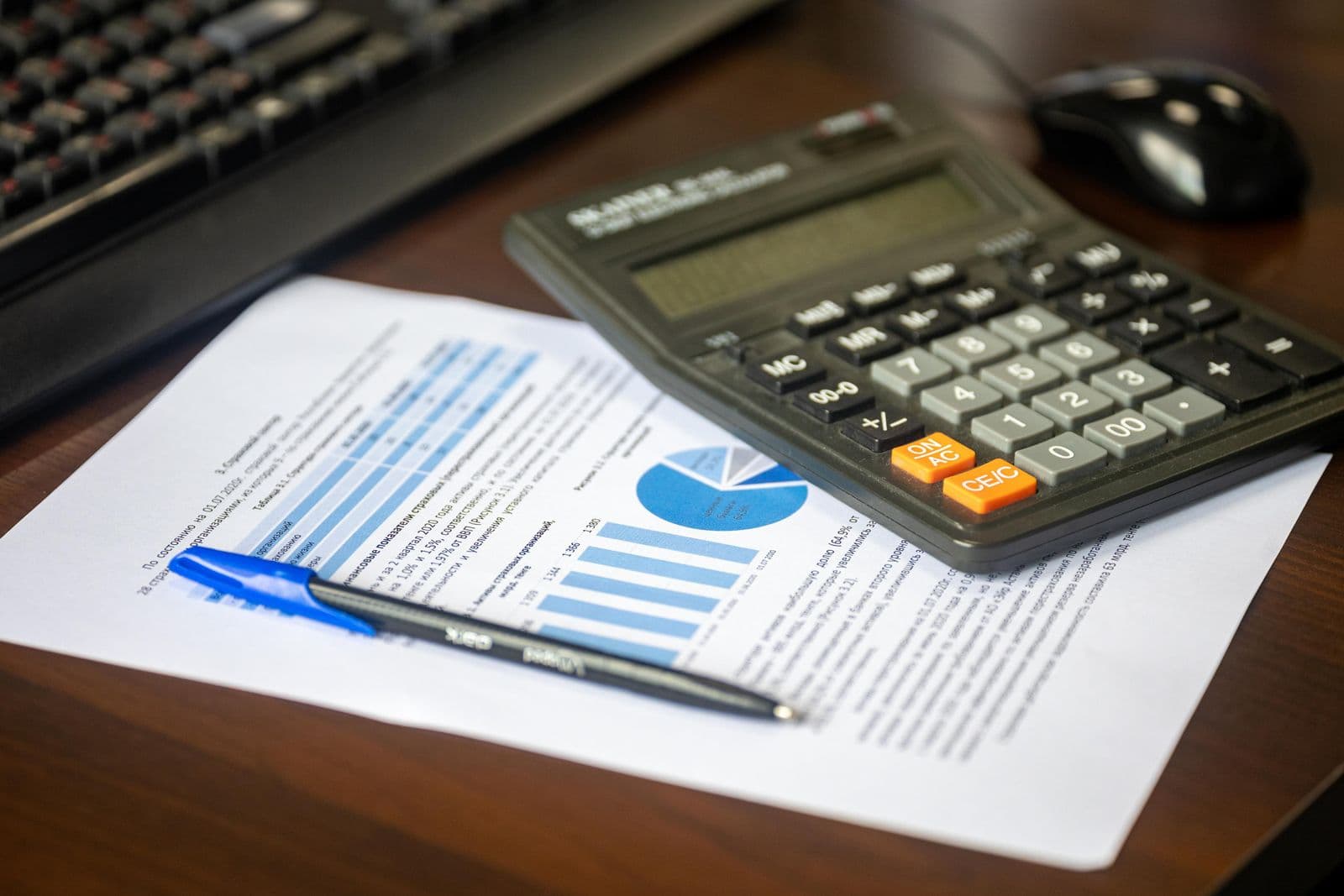 Financial report and calculator on a desk