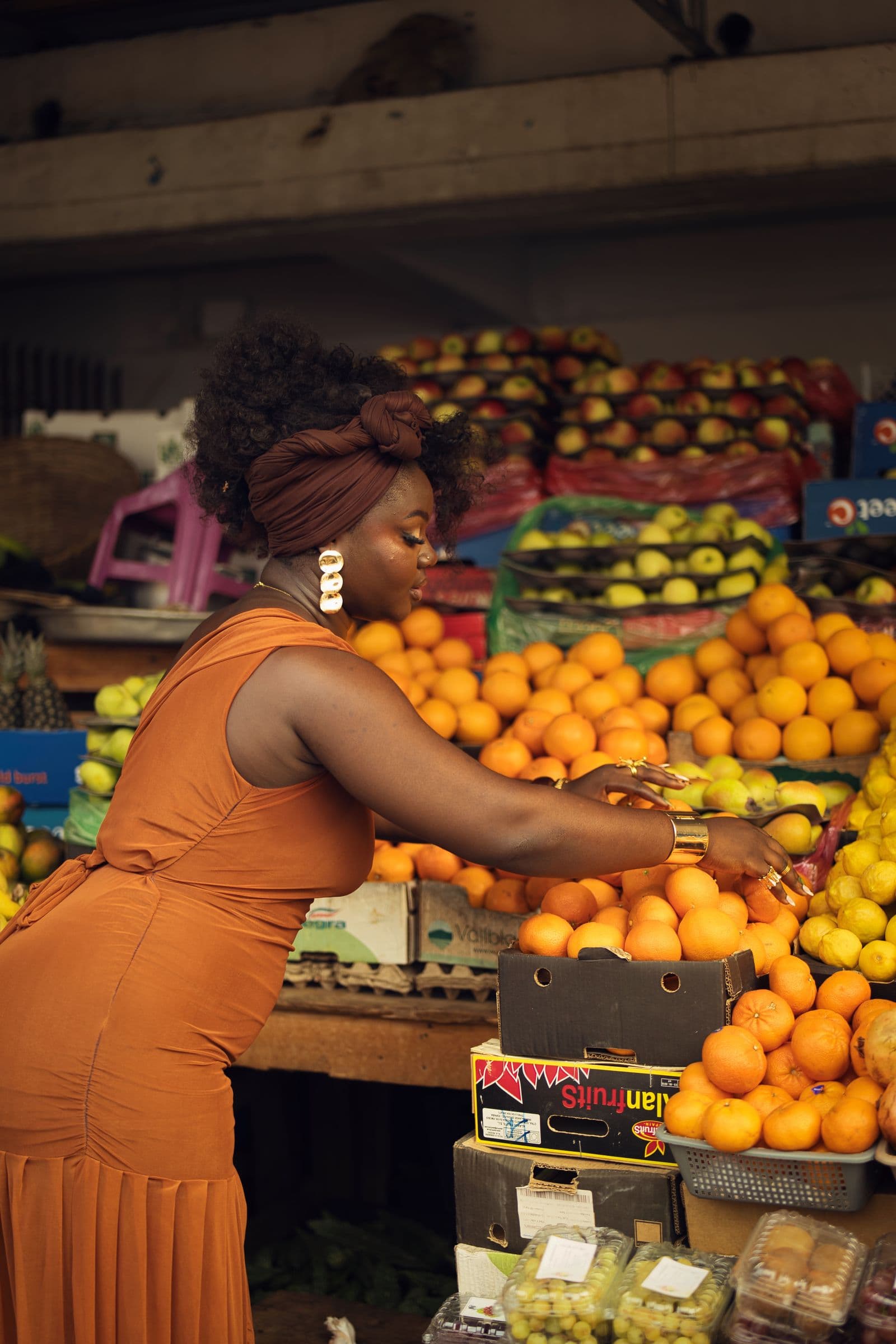 Business owner selling produce and taking payment from a customer