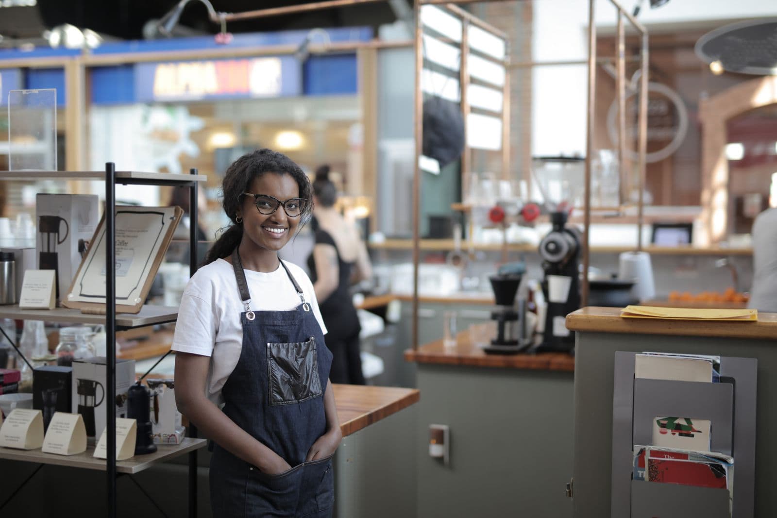 Shop owner serving a customer at the counter