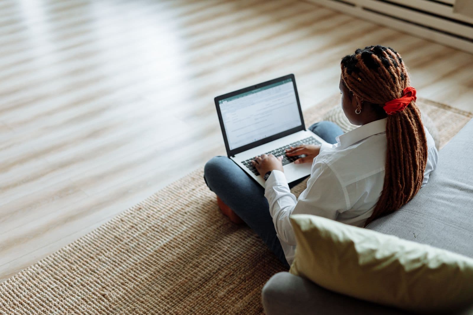 Freelancer invoicing a client from a laptop while working from home