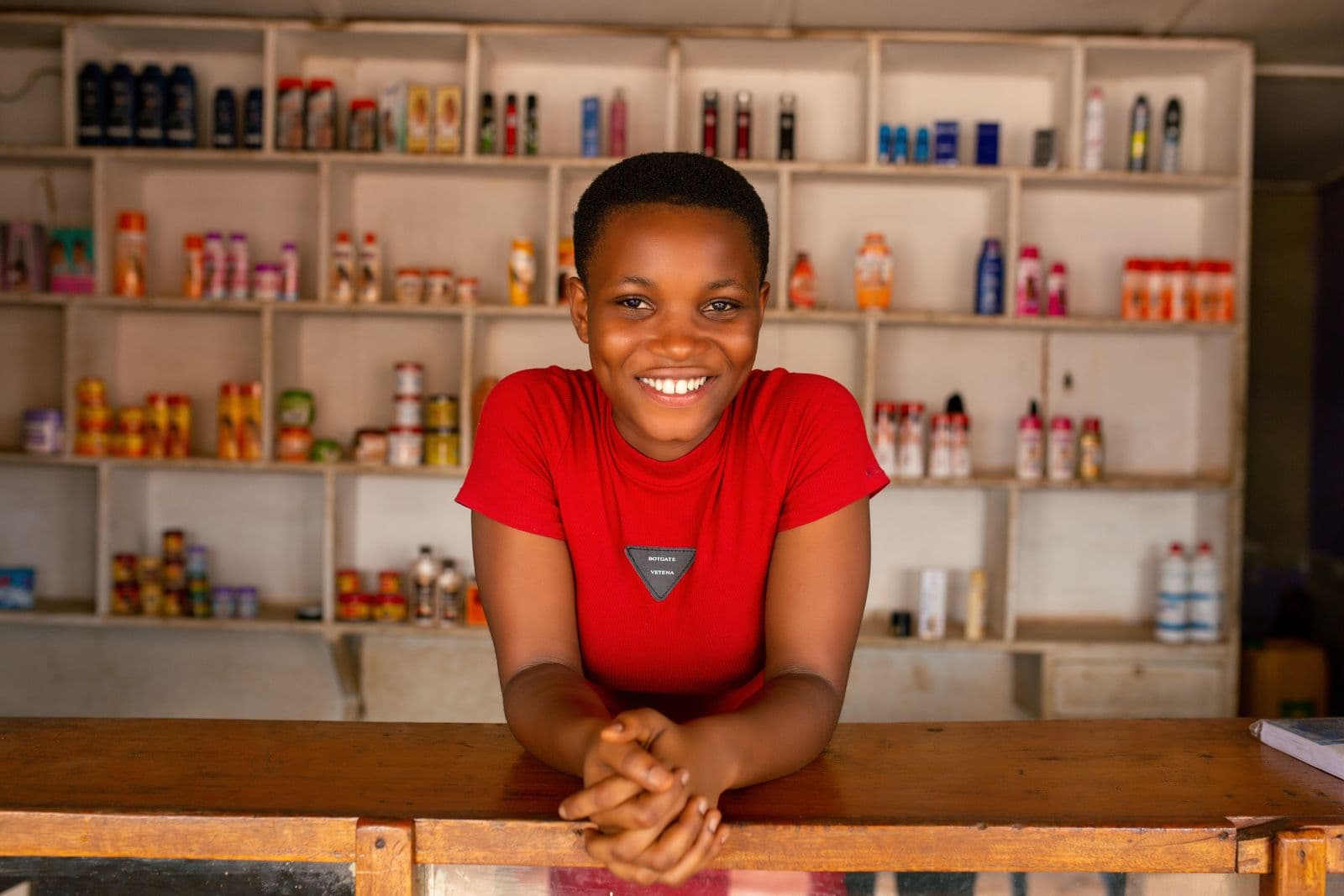 Small business owner behind the counter of her shop