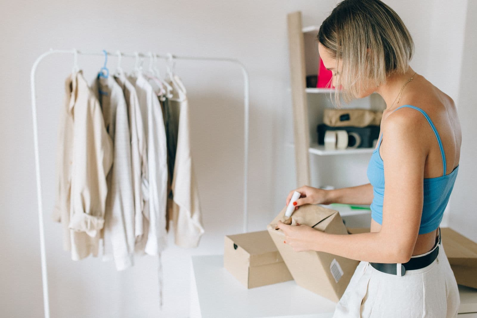 Business owner packing online orders for delivery