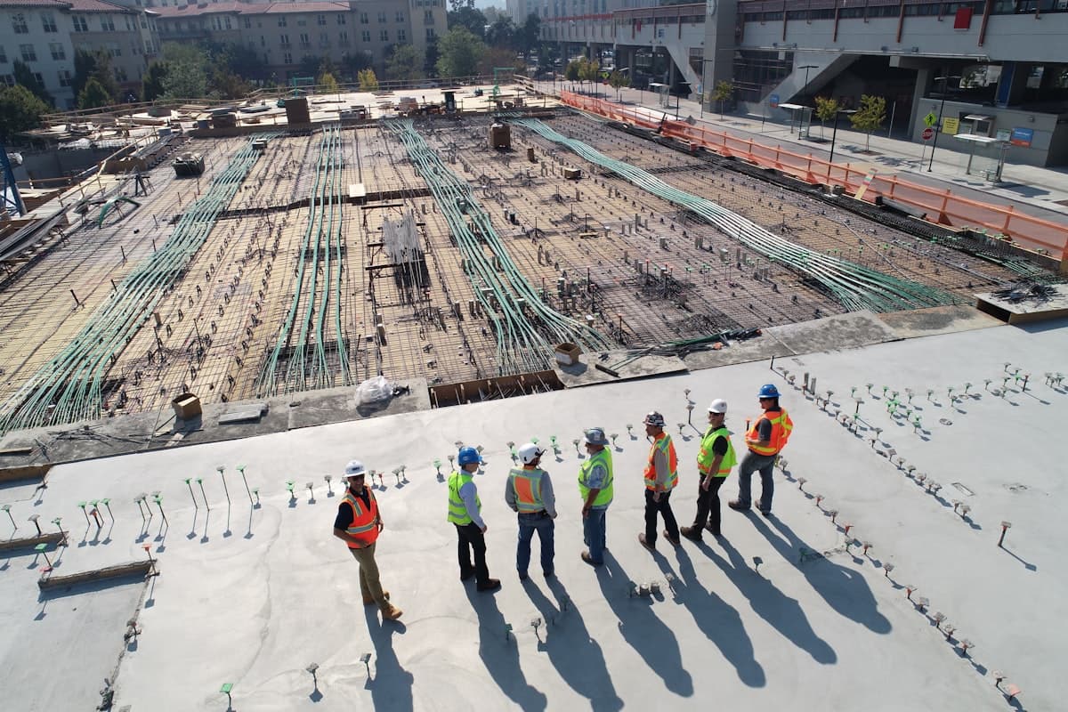 Construction site in Nigeria with workers and building materials