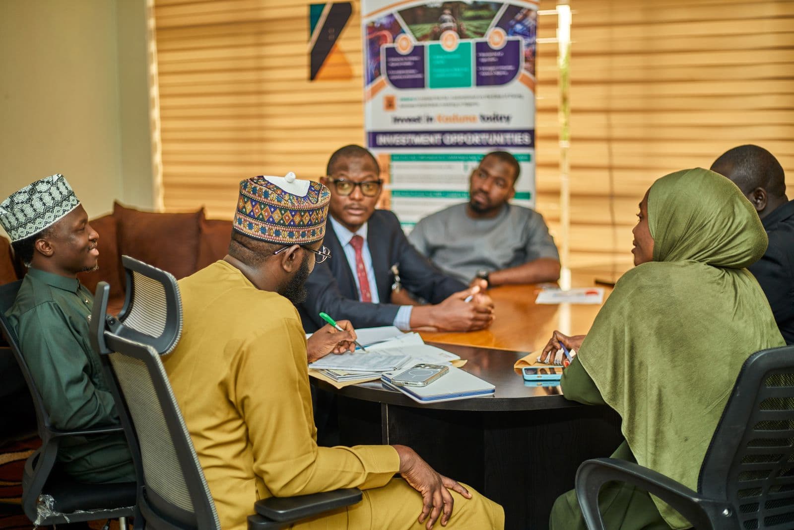 Executive team reviewing group financial reports in a boardroom